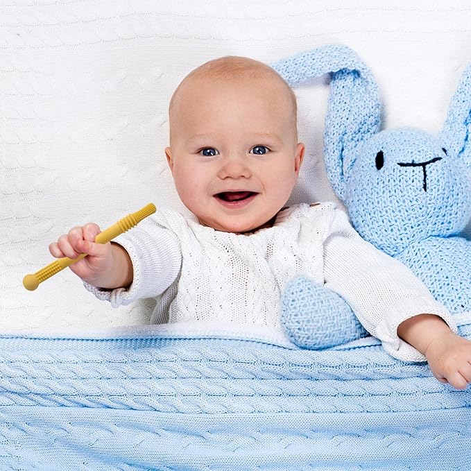 Blid mod tandkød baby biderør i silikone, farverigt design, ideel til små hænder.
