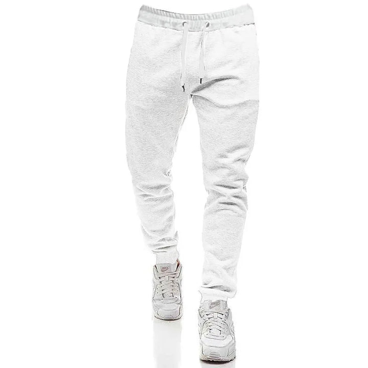 Unisex sorte joggingbukser med snøre, komfortable og trendy, passer perfekt til den moderne mands garderobe.